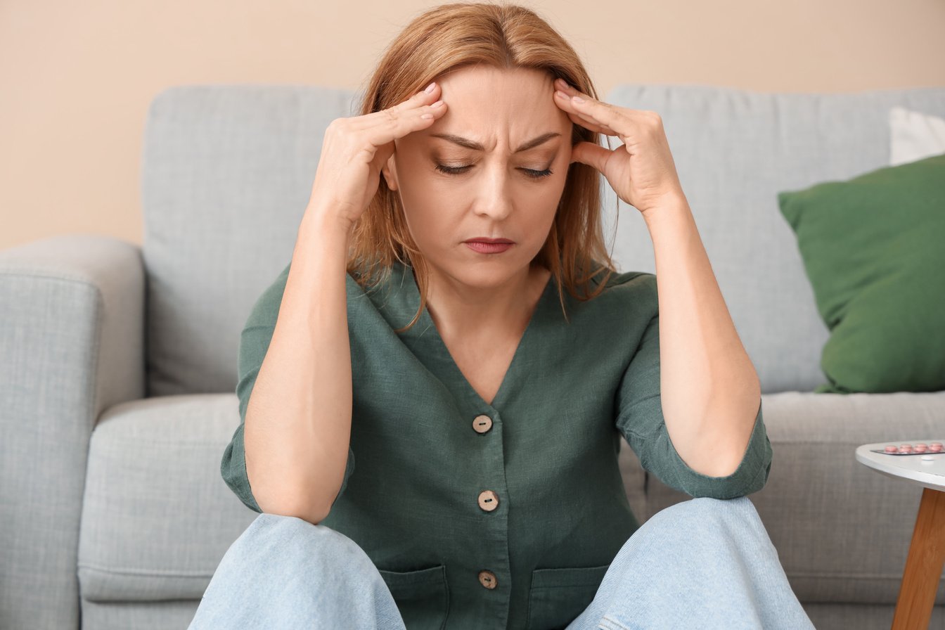 Mature Woman Experiencing Menopause at Home, Closeup